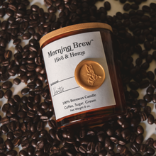 Load image into Gallery viewer, Flat lay of our apothecary beeswax candle against a plethora of fresh coffee beans
